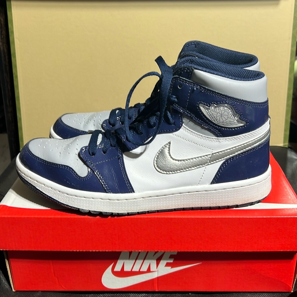 Jordan 1 High Golf Men’s 9 patent Blue, White, Silver swoosh.